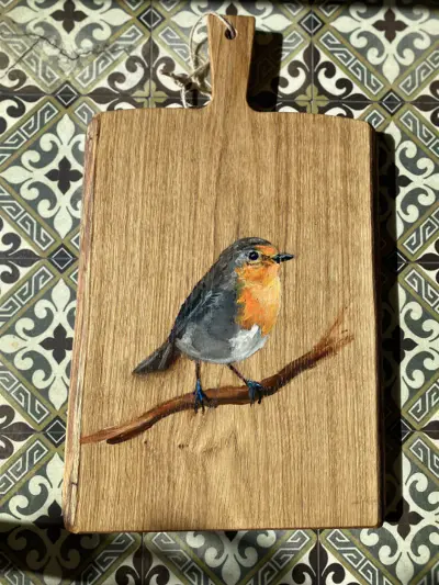 Foto van Eiken plank met roodborstje